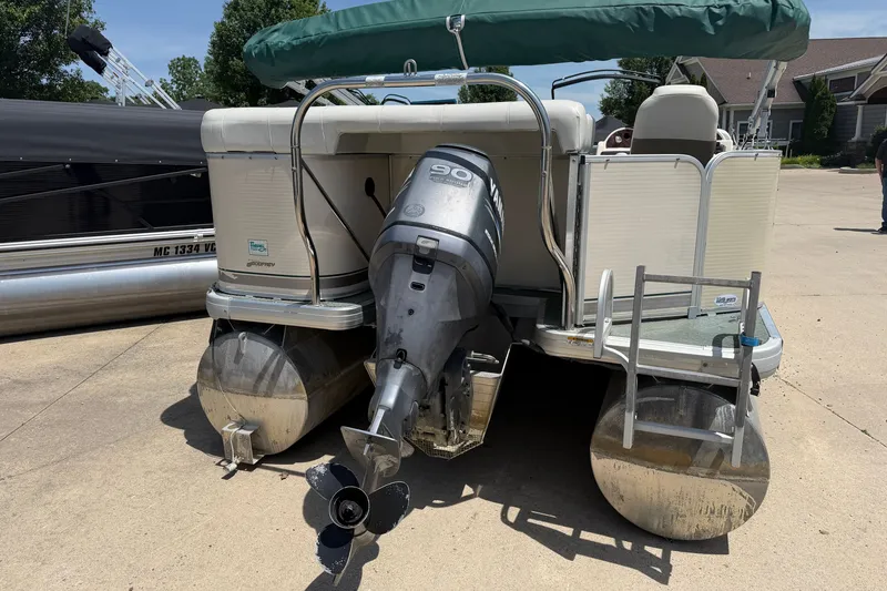Slide: The Image of 2006 Godfrey Aqua Patio pontoon boat with Yamaha 90 outboard motor and green canopy. - 10