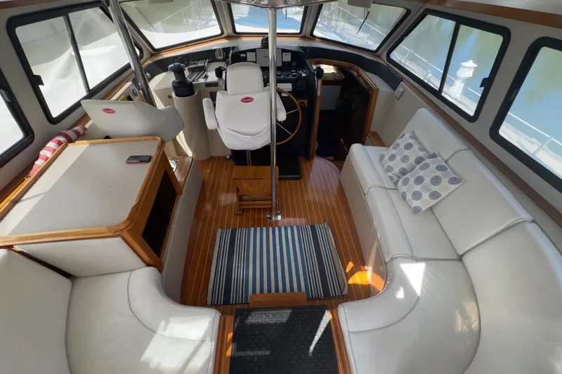 Slide: The Image of Interior of a 1984 Lancer Yachts Motor Sailer with elegant seating and helm. - 1