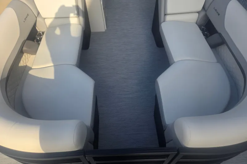 Slide: The Image of 2027 Lowe SS 230 WV boat interior with plush seating and modern design. - 9