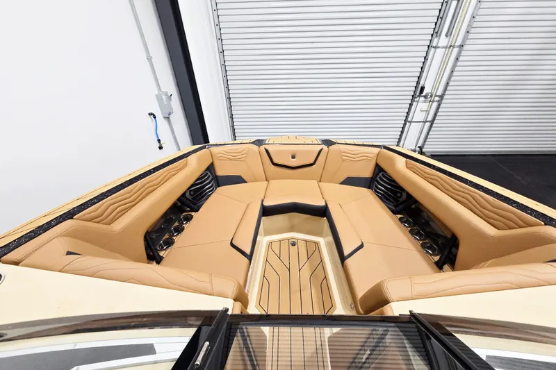 Slide: The Image of Luxurious interior of 2026 Nautique Super Air Nautique G23 boat with tan seating. - 10