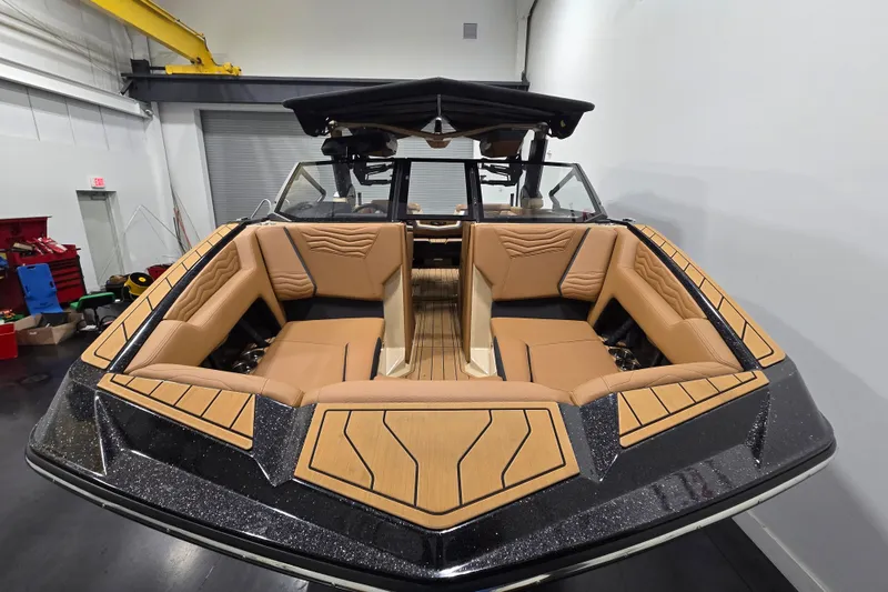 Slide: The Image of 2026 Nautique Super Air Nautique G23 boat with luxurious tan seating and sleek design. - 3