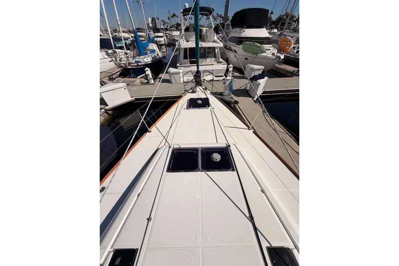 Slide: The Image of 2014 Jeanneau Sun Odyssey 469 sailboat docked at marina, view from deck. - 15