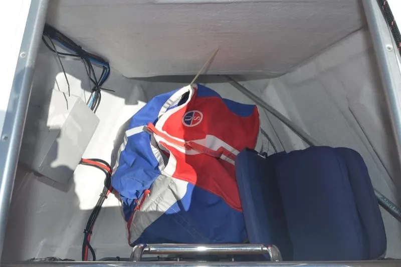 Slide: The Image of Storage compartment of 2014 Jeanneau Sun Odyssey 469 with colorful sail and equipment. - 18