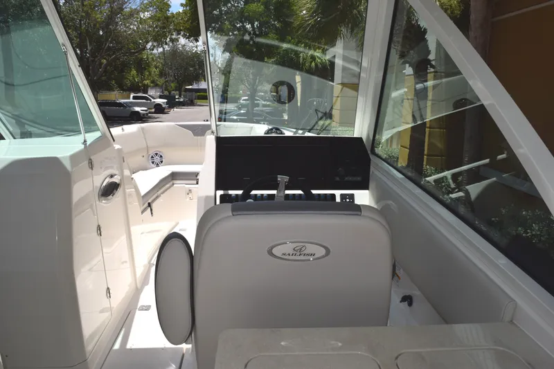 Slide: The Image of Interior view of 2027 Sailfish 276 DC boat, featuring helm and seating area. - 9