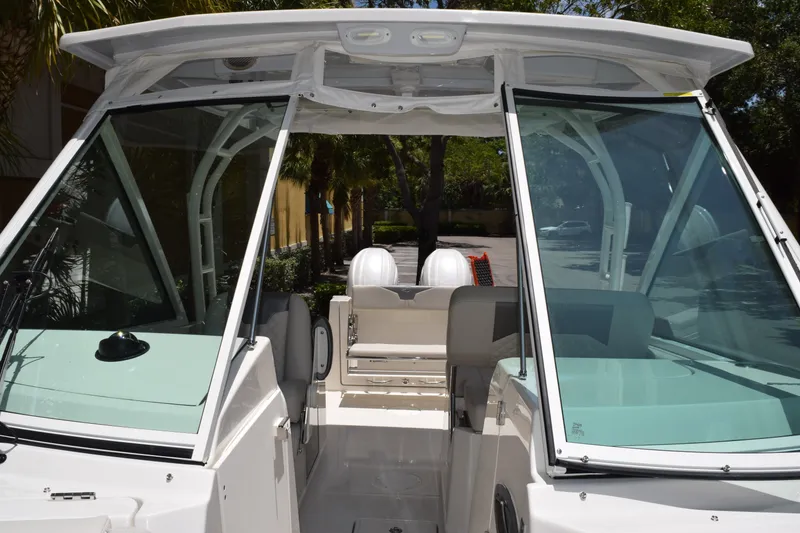 Slide: The Image of The 2027 Sailfish 276 DC features a modern cockpit with glass windows and comfortable seating. - 13