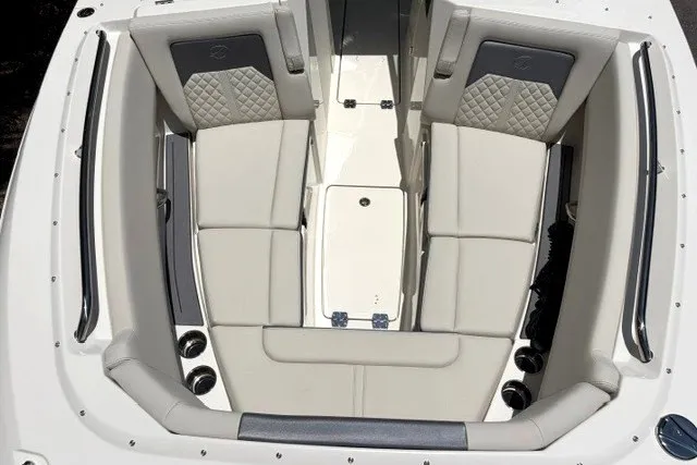 Slide: The Image of The 2027 Sailfish 276 DC features a sleek, modern cockpit with cushioned seating and cup holders. - 12