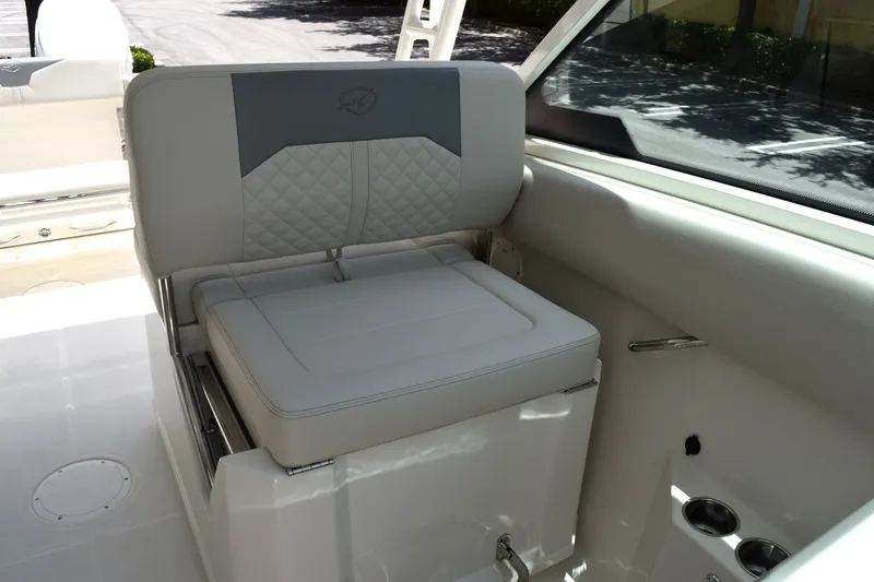 Slide: The Image of The 2027 Sailfish 276 DC interior features a cushioned seat with elegant stitching. - 6