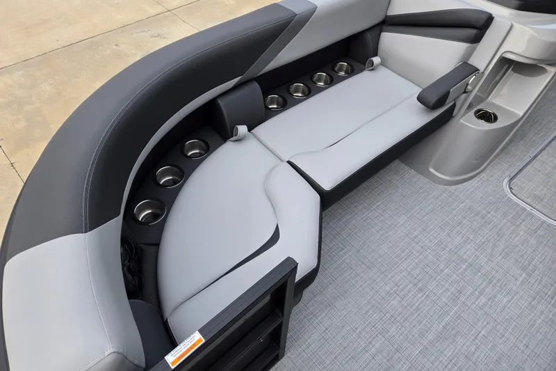 Slide: The Image of The image shows a sleek, gray seating area with multiple cup holders on a boat. - 11