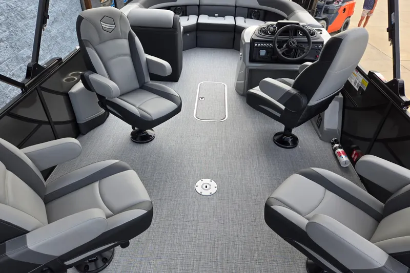 Slide: The Image of The image shows the interior of a modern pontoon boat with four swivel seats and a helm station. - 5