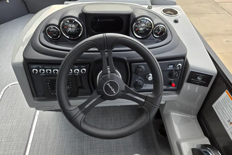Slide: The Image of The image shows the helm of a South Bay SS224QC3.0 boat with modern instruments. - 7