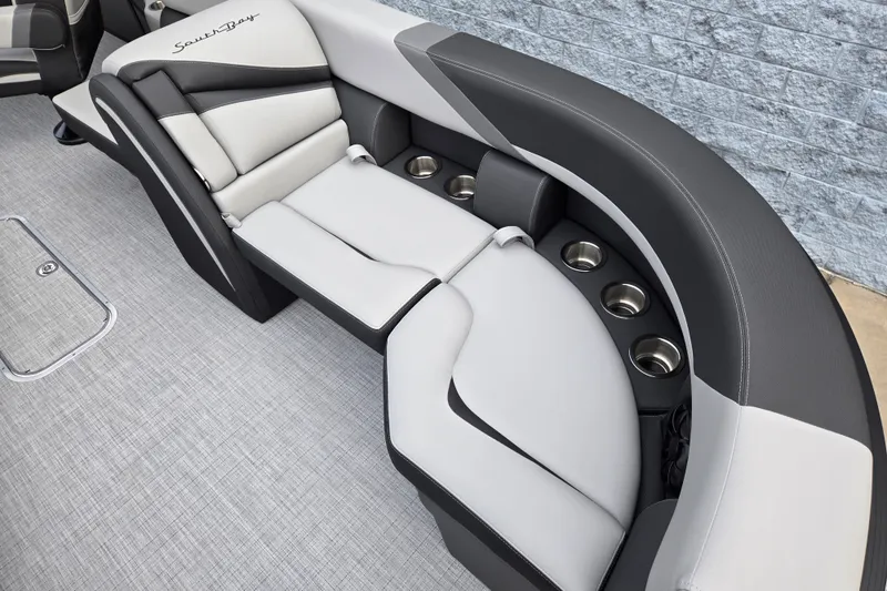 Slide: The Image of Elegant gray and black seating area with cup holders on a South Bay SS224QC3.0 boat. - 12