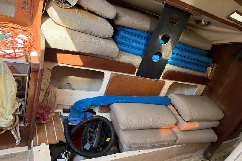 Slide: The Image of Interior of a 1978 Santana 35 sailboat with cushions and storage compartments. - 6
