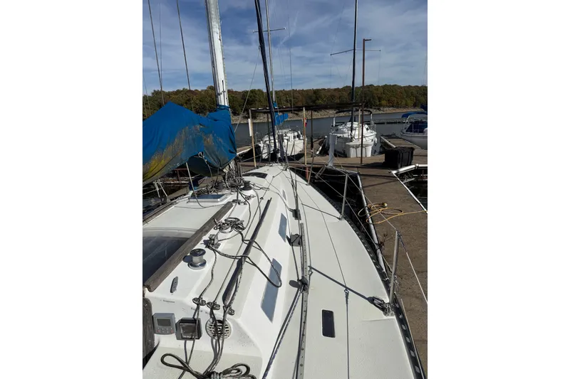 Slide: The Image of 1978 Santana 35 sailboat docked at marina, featuring deck and rigging details. - 7