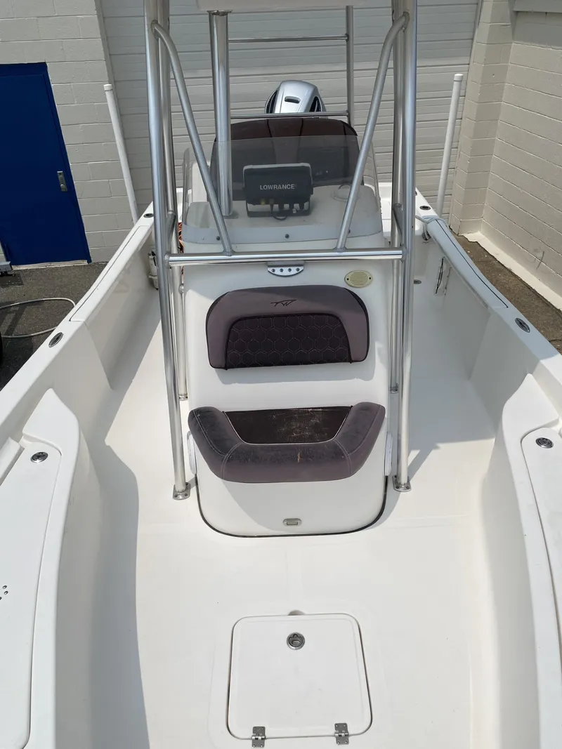 Slide: The Image of The image shows the cockpit of a 2018 Tidewater 22 Bay boat with a helm console and seating. - 5