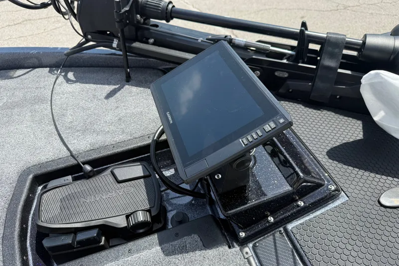 Slide: The Image of Garmin display and foot pedal on 2027 Phoenix 921 Elite X boat deck. - 8