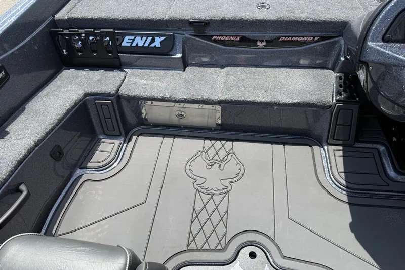 Slide: The Image of Interior of 2027 Phoenix 921 Elite X boat with custom flooring and storage compartments. - 18
