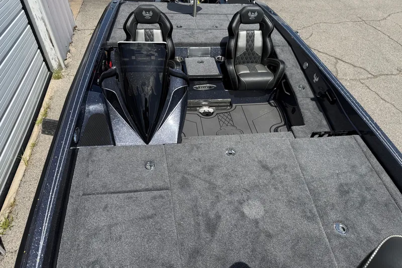 Slide: The Image of 2027 Phoenix 921 Elite X boat interior with dual seats and spacious deck. - 9