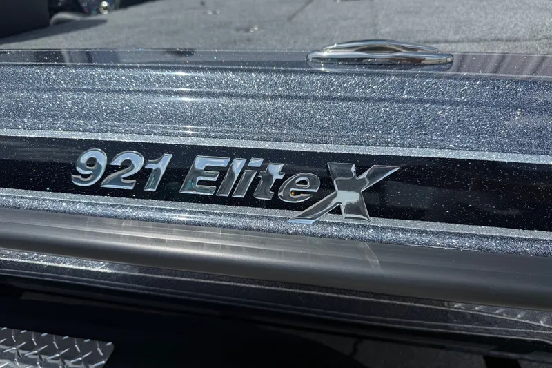 Slide: The Image of 2027 Phoenix 921 Elite X boat emblem with metallic finish. - 3