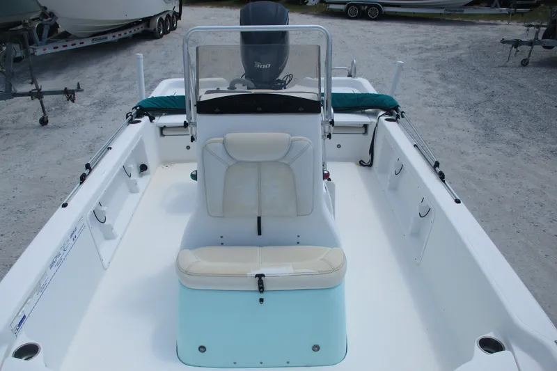 Slide: The Image of 2016 BLUEWAVE 24 Pure Bay boat interior with seating and steering console. - 13