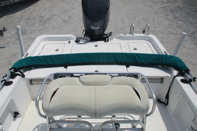 Slide: The Image of 2016 BLUEWAVE 24 Pure Bay boat interior with seating and motor. - 3