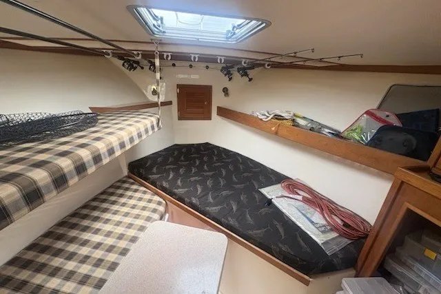 Slide: The Image of 2003 Albemarle 305 Express Fisherman cabin with cozy bunks and fishing gear storage. - 27