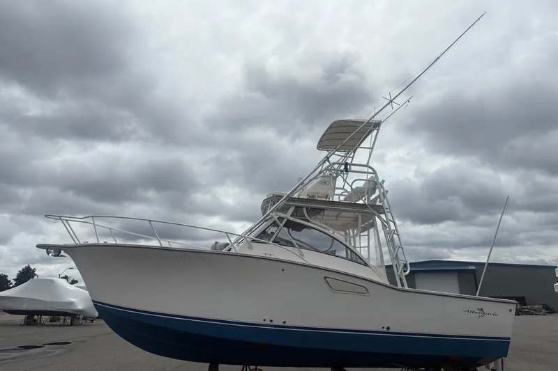 Slide: The Image of 2003 Albemarle 305 Express Fisherman boat under cloudy skies, side view. - 6