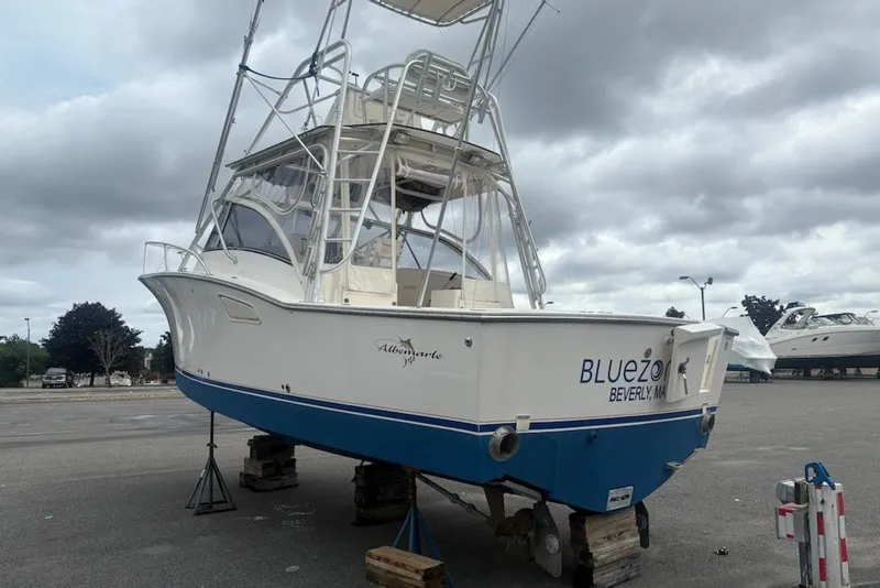 Slide: The Image of 2003 Albemarle 305 Express Fisherman boat on stands, cloudy sky background. - 4
