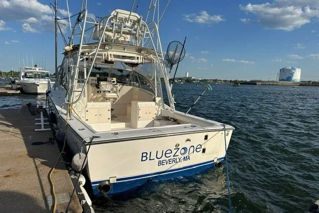 Slide: The Image of 2003 Albemarle 305 Express Fisherman boat docked at marina, labeled "Bluezone" in Beverly, MA. - 8