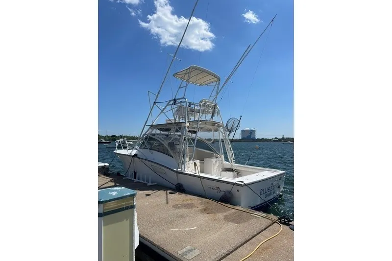 The Image of 2003 Albemarle 305 Express Fisherman boat docked under clear blue sky. - 9