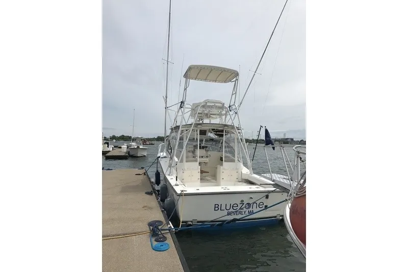 Slide: The Image of 2003 Albemarle 305 Express Fisherman docked at marina, rear view. - 10