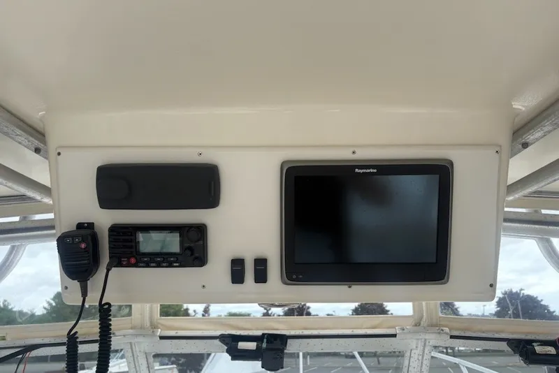 Slide: The Image of Control panel of a 2003 Albemarle 305 Express Fisherman boat with navigation equipment. - 24