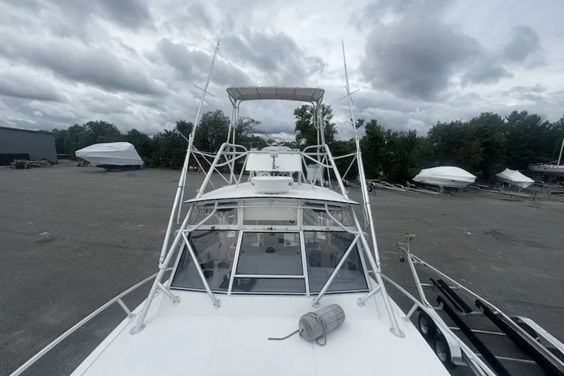 Slide: The Image of 2003 Albemarle 305 Express Fisherman boat on trailer, cloudy sky background. - 16
