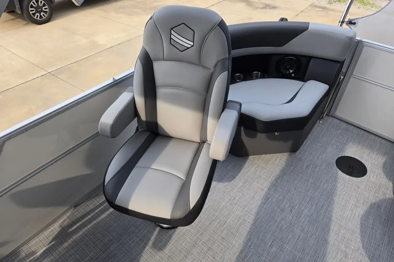 Slide: The Image of A modern, cushioned boat seat in gray and black on a textured floor. - 9