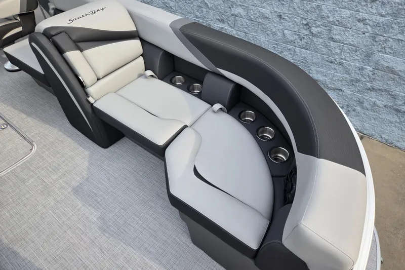 Slide: The Image of The image shows an elegant, cushioned seating area with built-in cup holders on a boat. - 4