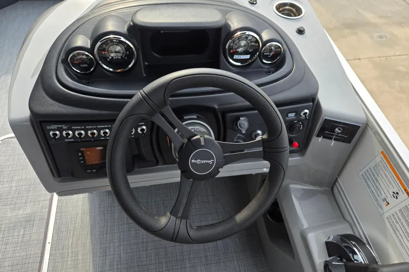 Slide: The Image of The image shows the helm of a 2027 South Bay SS224QC3.O boat with modern instruments. - 11