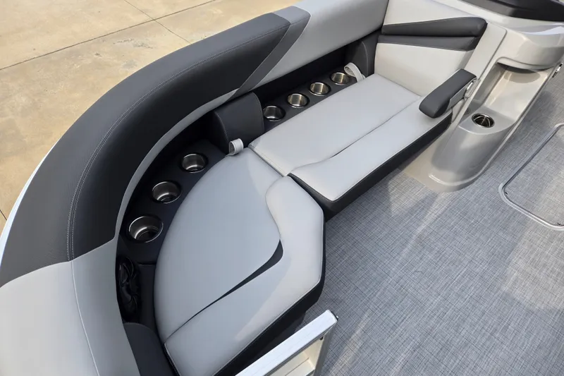 Slide: The Image of The image shows a sleek gray seating area on a boat with multiple cup holders. - 5