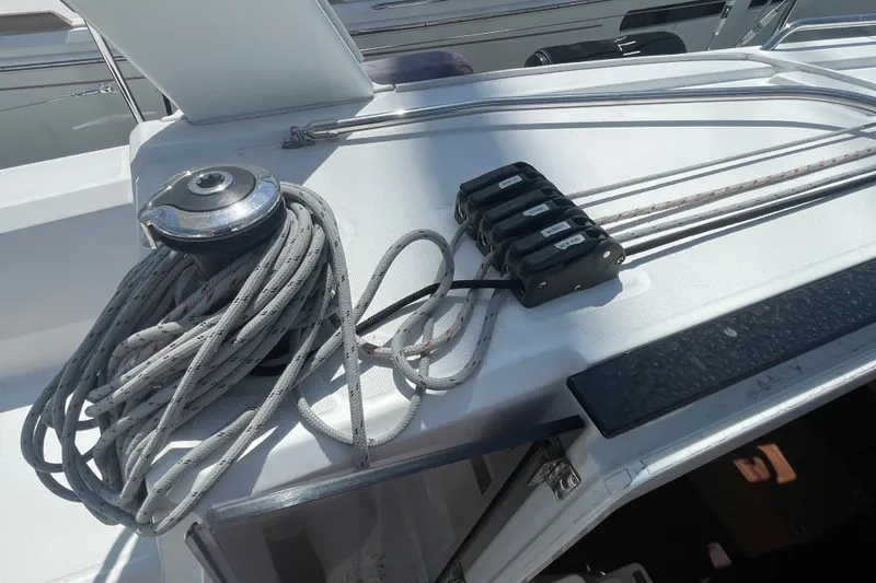 Slide: The Image of Winch and ropes on 2016 Beneteau Oceanis 35 sailboat deck. - 16