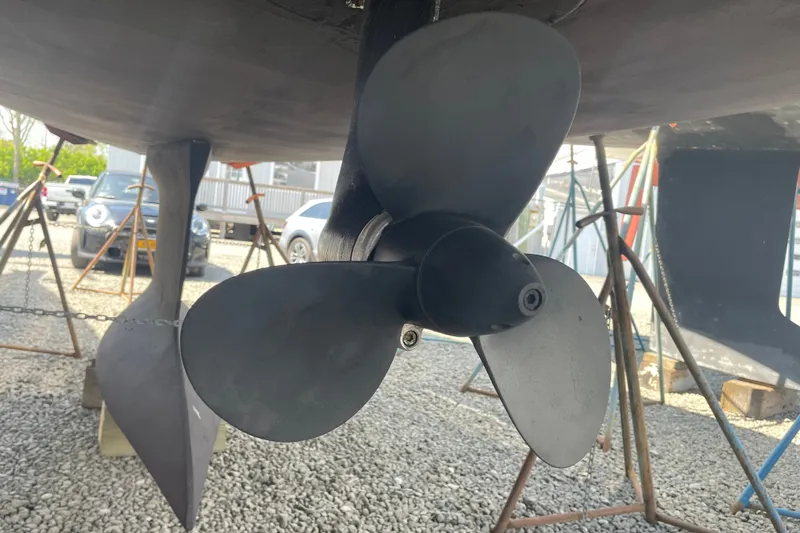 Slide: The Image of Propeller of a 2016 Beneteau Oceanis 35 sailboat on a gravel surface. - 19