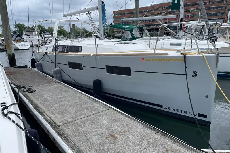 Slide: The Image of 2016 Beneteau Oceanis 35 sailboat docked at marina, side view. - 5