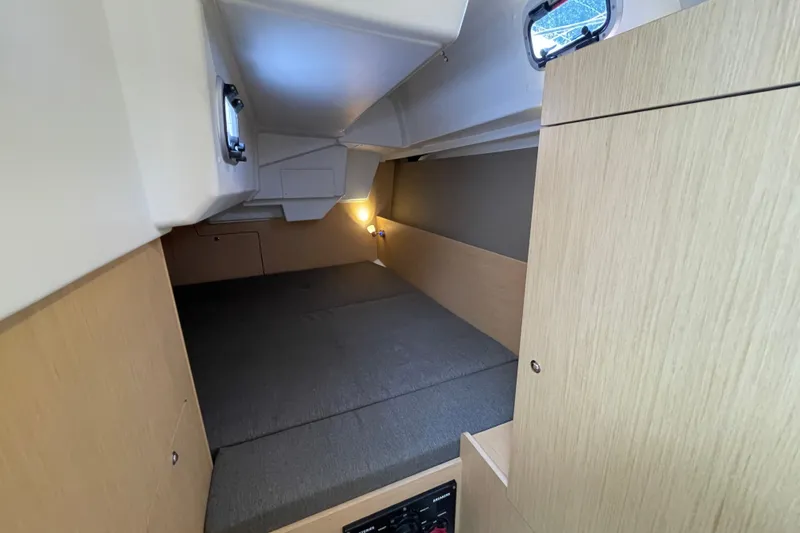 Slide: The Image of Interior cabin of 2016 Beneteau Oceanis 35 sailboat, featuring cozy sleeping area. - 34
