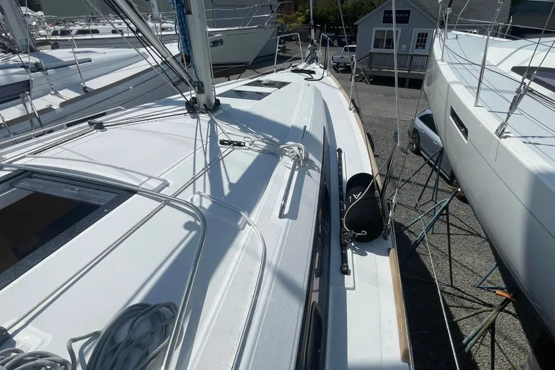 Slide: The Image of 2016 Beneteau Oceanis 35 sailboat deck view, showcasing sleek design and rigging details. - 15
