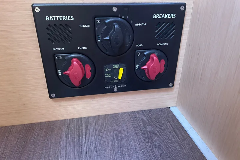 Slide: The Image of Control panel of a 2016 Beneteau Oceanis 35 sailboat, featuring battery and breaker switches. - 41