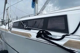 Slide: The Image of 2016 Beneteau Oceanis 35 sailboat with sleek design and modern windows. - 7