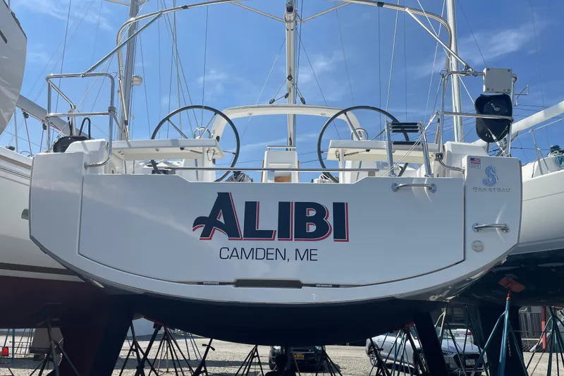 Slide: The Image of 2016 Beneteau Oceanis 35 sailboat named "Alibi" in Camden, ME, on display. - 3