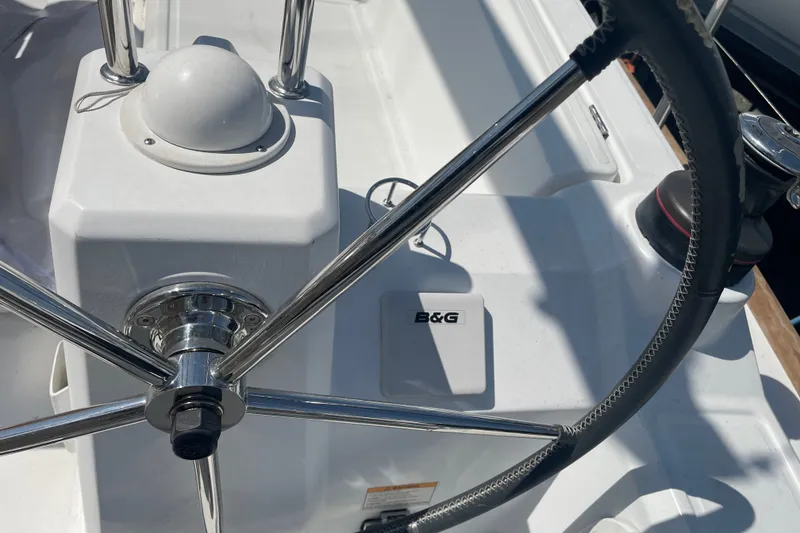 Slide: The Image of Steering wheel and controls of a 2016 Beneteau Oceanis 35 sailboat. - 14