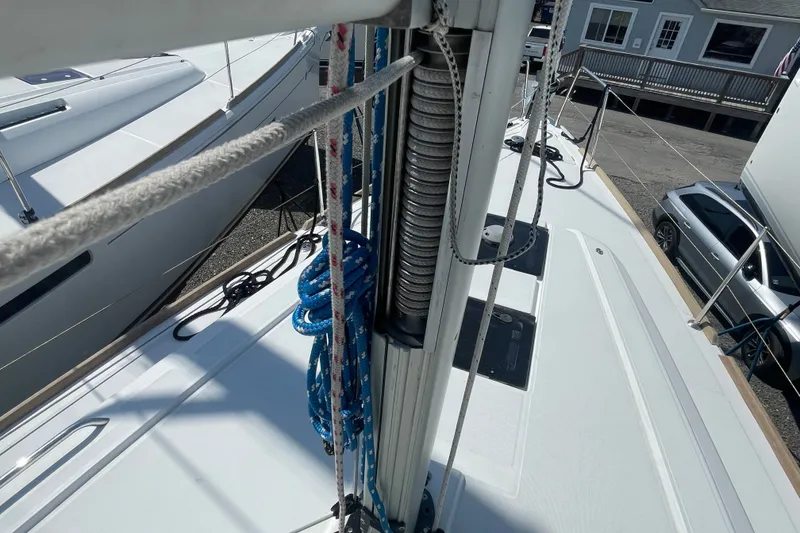 Slide: The Image of Deck view of a 2016 Beneteau Oceanis 35 sailboat, showcasing rigging and ropes. - 17