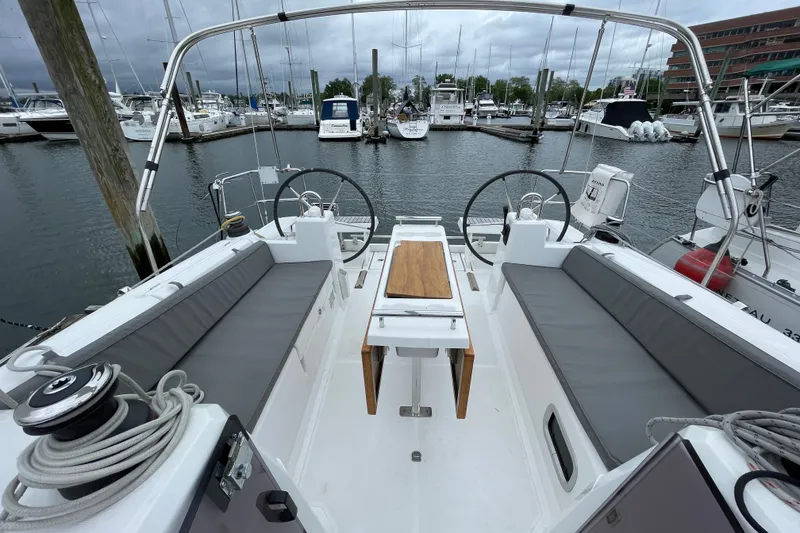 Slide: The Image of Cockpit view of a 2016 Beneteau Oceanis 35 sailboat docked at a marina. - 8