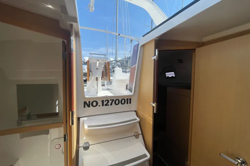 Slide: The Image of Interior view of 2016 Beneteau Oceanis 35 sailboat, showing cabin entrance and steps. - 21