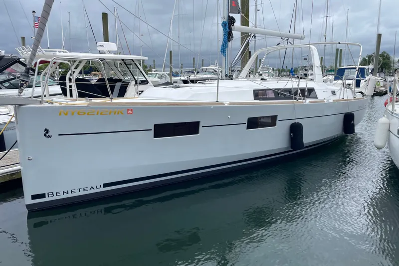 Slide: The Image of 2016 Beneteau Oceanis 35 sailboat docked in a marina, overcast sky. - 6