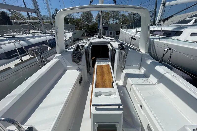 Slide: The Image of 2016 Beneteau Oceanis 35 sailboat cockpit with sleek design and wooden accents. - 9